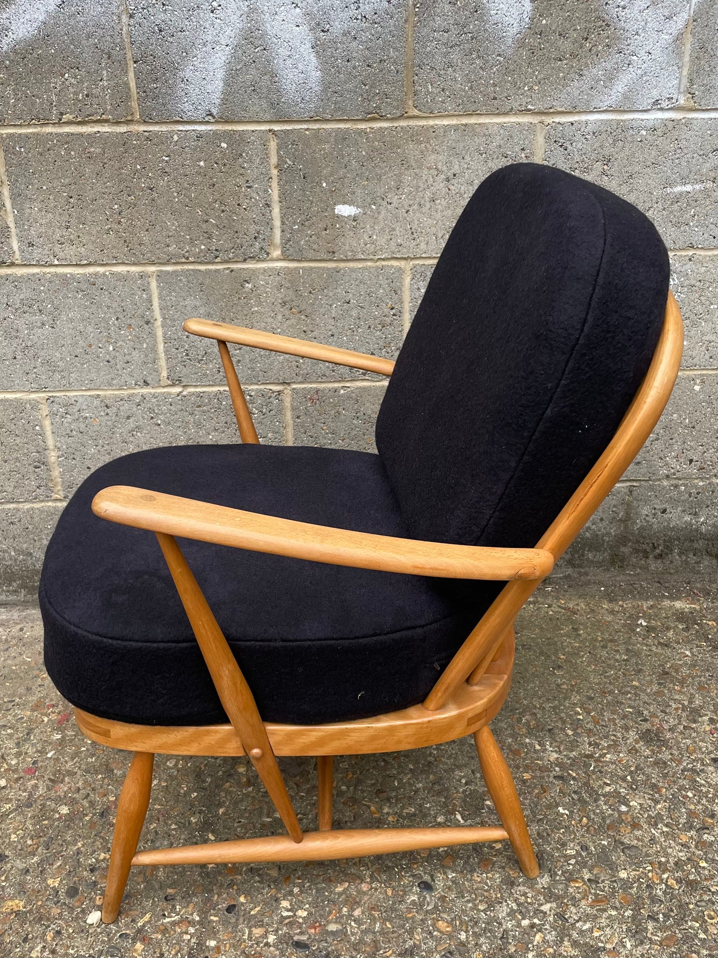 Ercol Windsor 334 Armchair side view with dark dark grey cushion covers